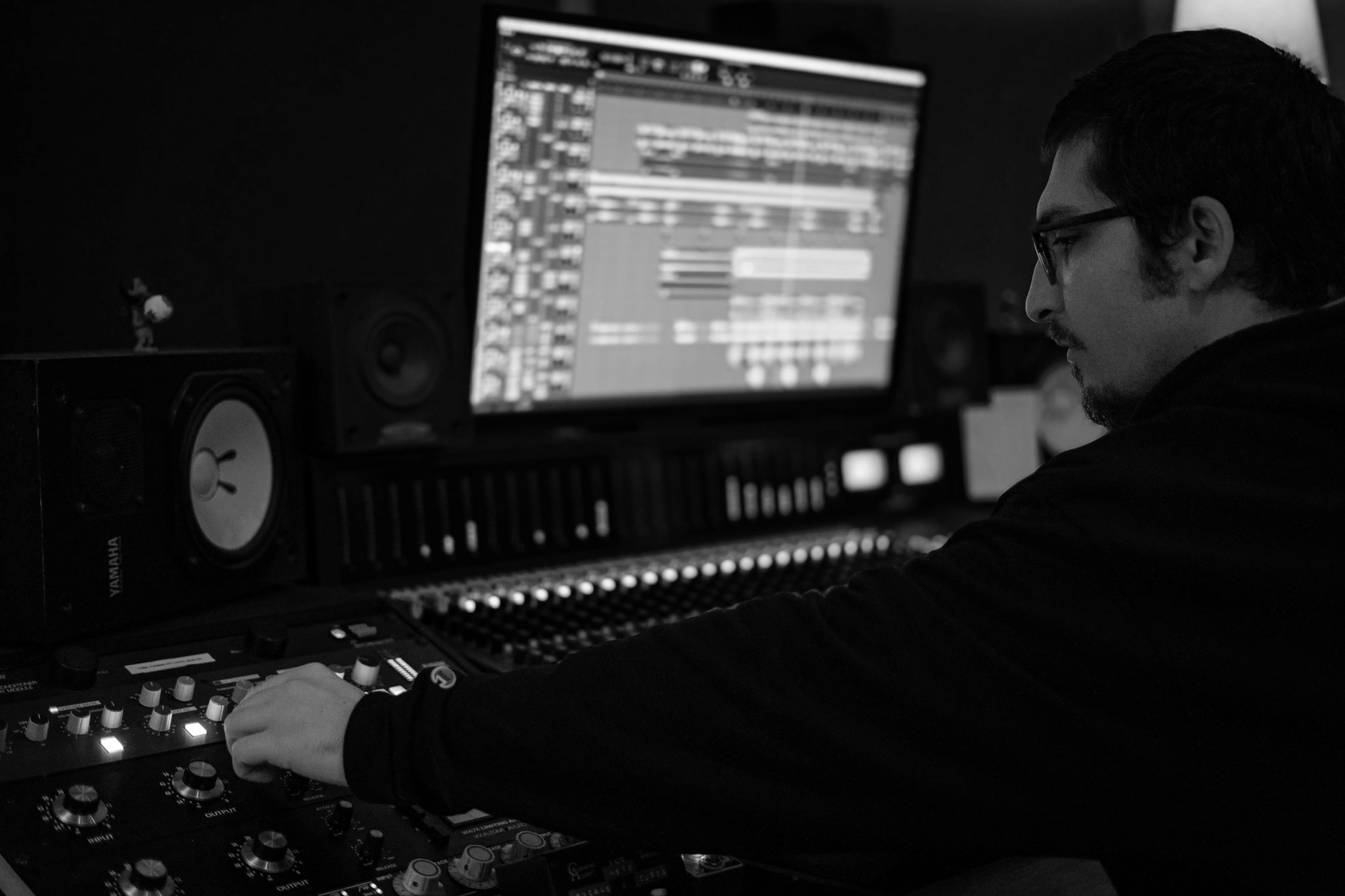 Jimmy working on mixing a song at the studio.